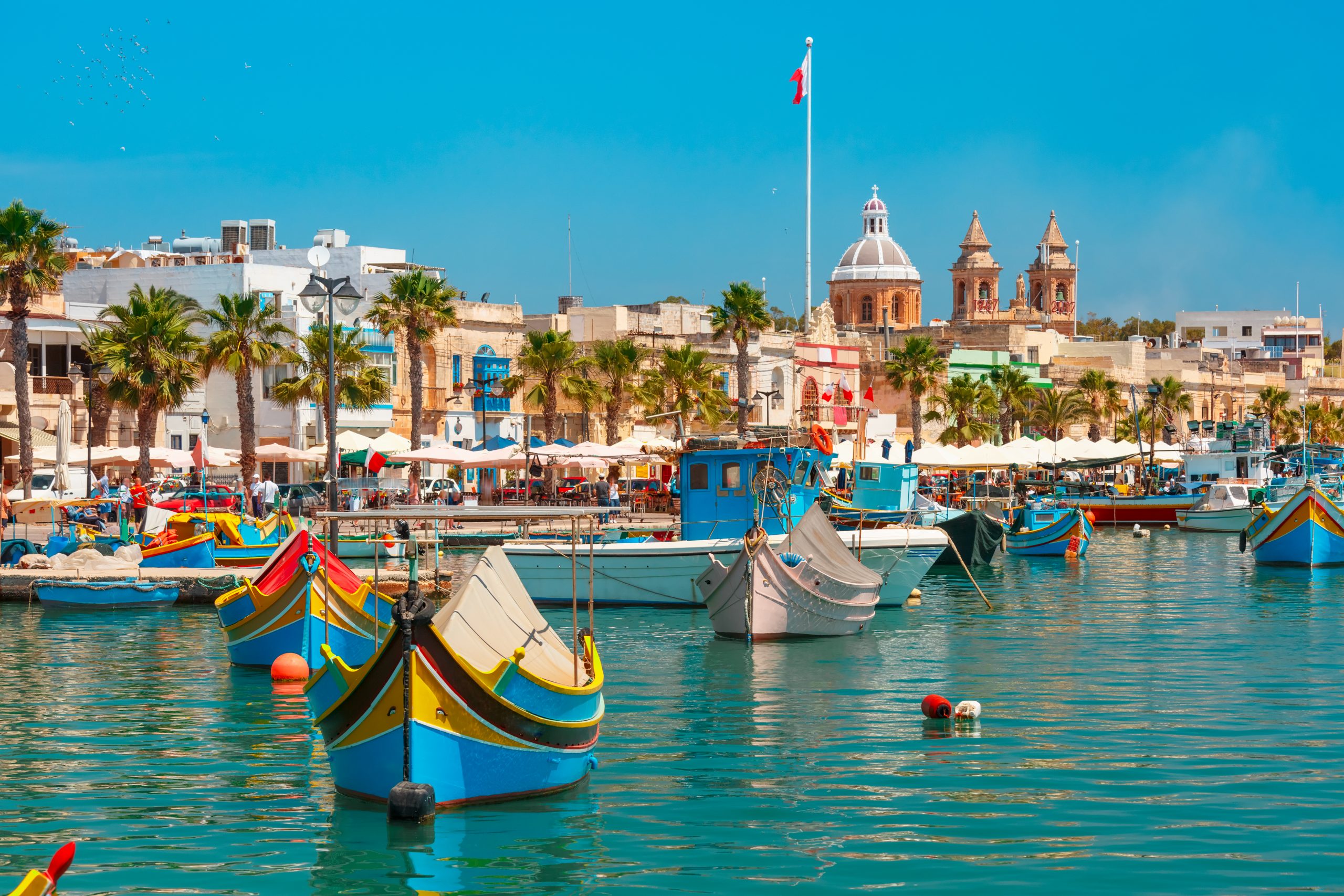 traditional-eyed-colorful-boats-luzzu-harbor-mediterranean-fishing-village-marsaxlokk-malta-scaled-1.jpg